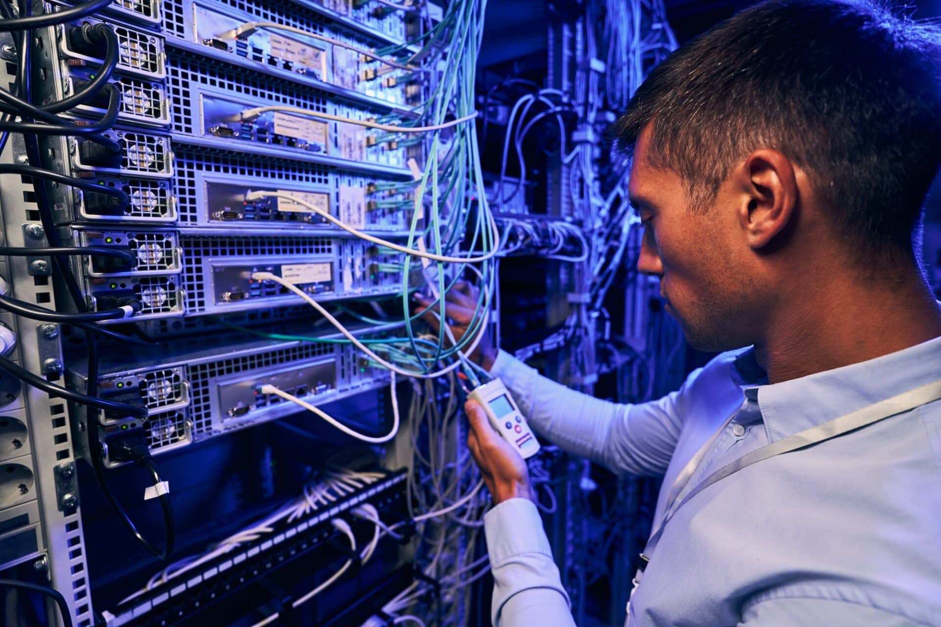 maintenance technician performing diagnostic test of optical networks